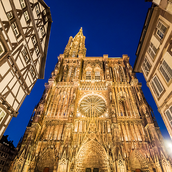 Strasbourg Cathedral or the Cathedral of Our Lady of Strasbourg illuminated at night. Alsace, France
